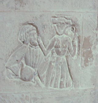 Medieval grafitto of woman
cook berating
a man